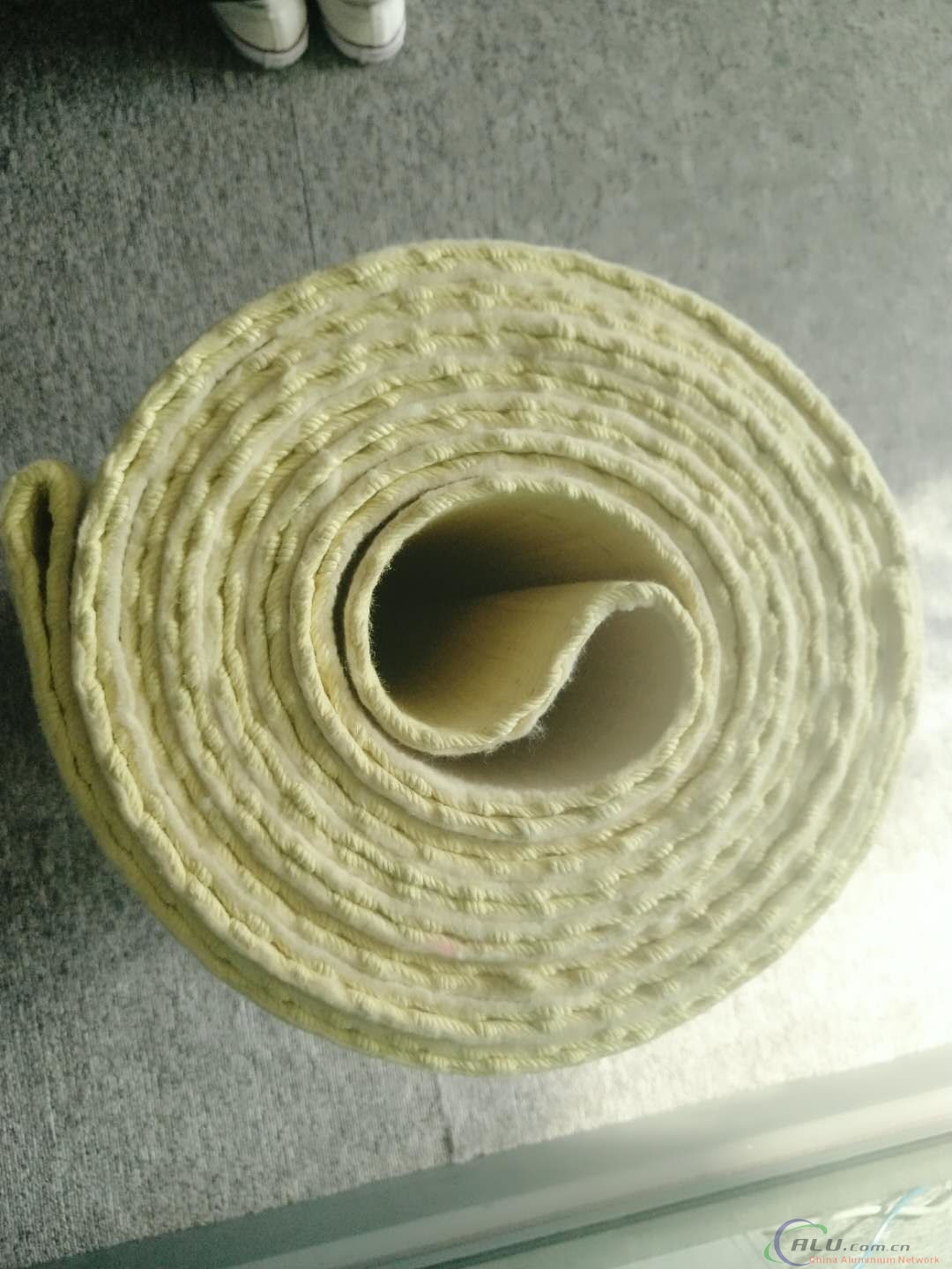 Belt for belt wrapper at hot rolling mill for aluminium